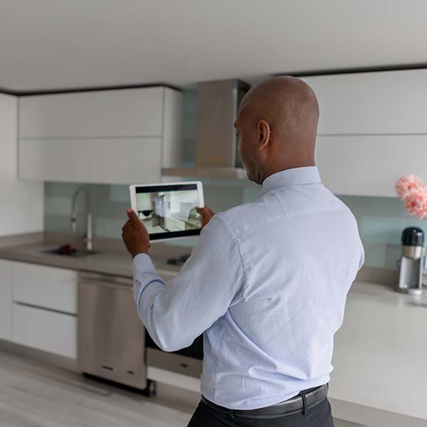 Realtor making a virtual tour of a house using a tablet computer